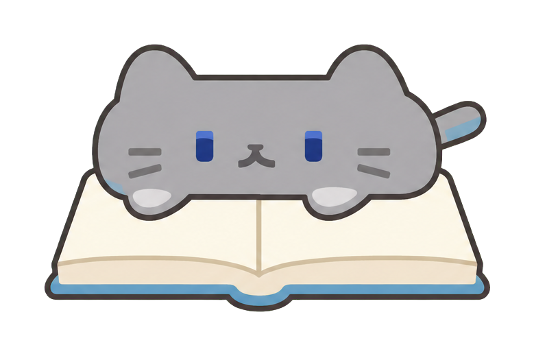 本の上のネコ